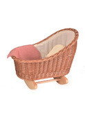Wicker cradle with knitted blanket